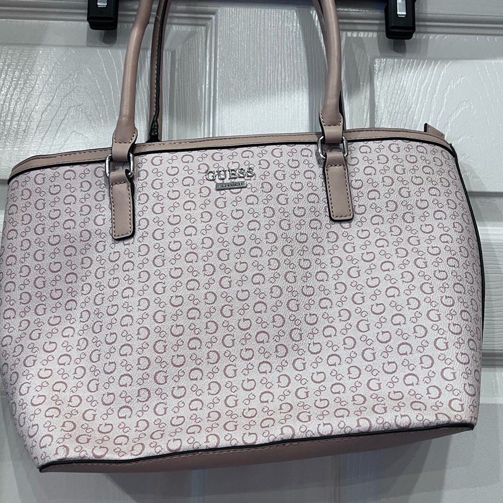 Guess Los Angeles Hand Bag multiple pockets beautiful colors great condition.